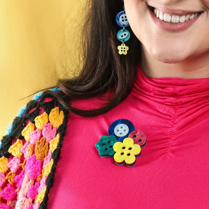 Button brooch on sale