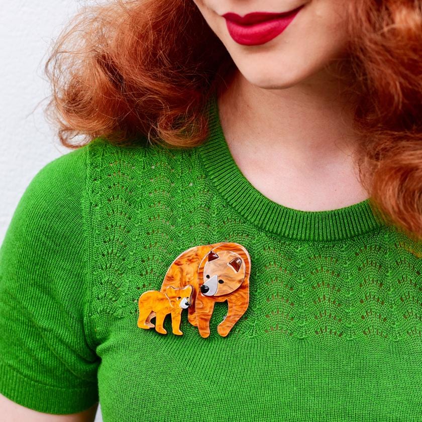 https://www.erstwilder.com/cdn/shop/products/erstwilder-mama-bear-brooch-model-brown_850x.jpg?v=1602144440